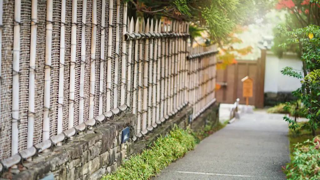 Here's an awesome view of bamboo fence along the home on a sloping lot. 