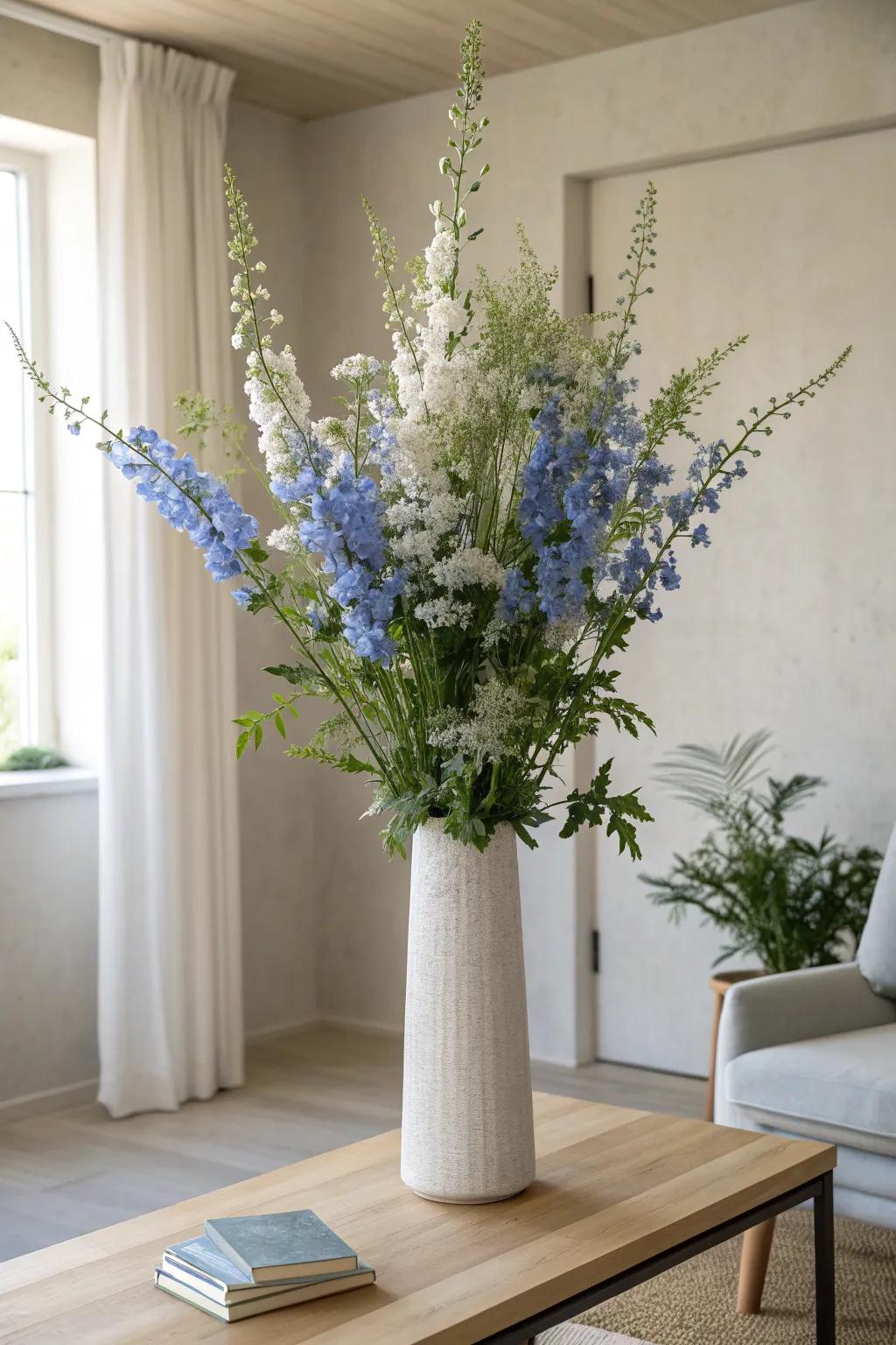 Blue delphiniums add vertical drama and elegance to any mantelpiece. 🌸 #ElegantHome #DelphiniumLove